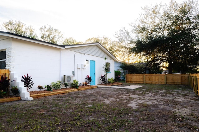 rear view of property with ac unit