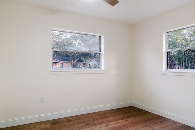 spare room with wood-type flooring