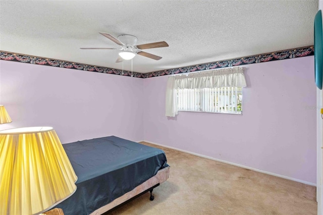 carpeted bedroom with ceiling fan, a textured ceiling, and billiards