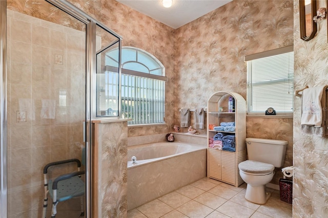 bathroom with toilet, tile patterned floors, and independent shower and bath