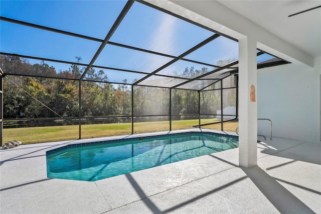 view of swimming pool featuring a lanai, a yard, and a patio