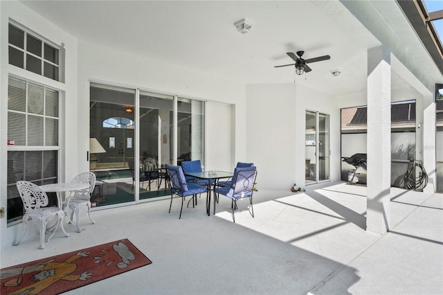 view of patio featuring ceiling fan