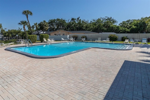 view of pool featuring a patio area