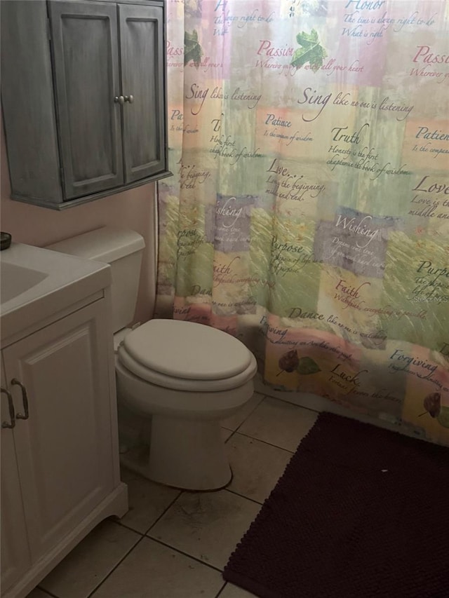 full bathroom with tile patterned floors, vanity, toilet, and shower / bathtub combination with curtain