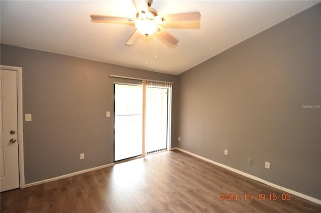 unfurnished room featuring wood-type flooring, ceiling fan, and lofted ceiling