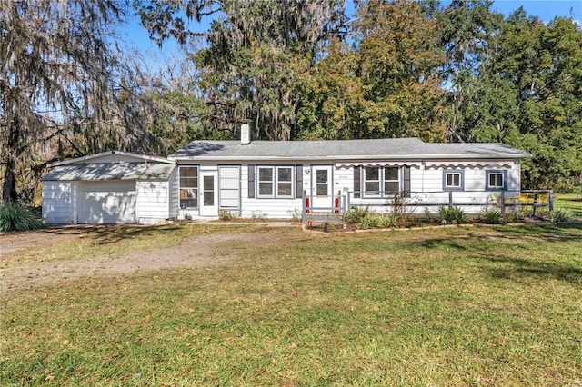 ranch-style house with a front yard and a garage