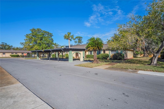 view of front of house with a carport