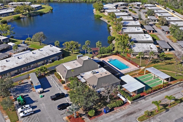 birds eye view of property featuring a water view