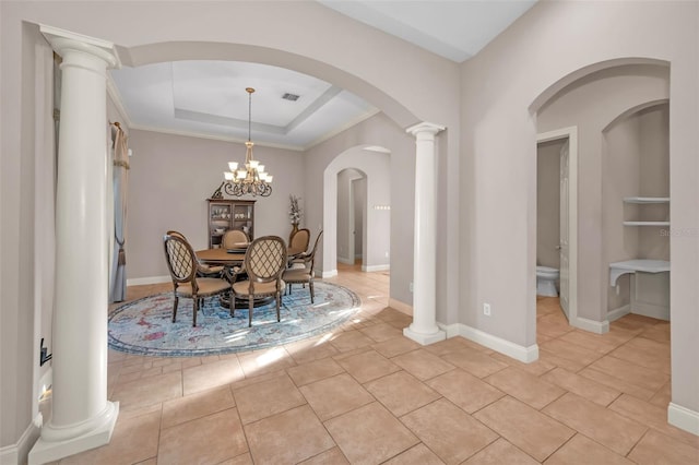 dining space featuring light tile patterned floors, decorative columns, visible vents, baseboards, and a tray ceiling