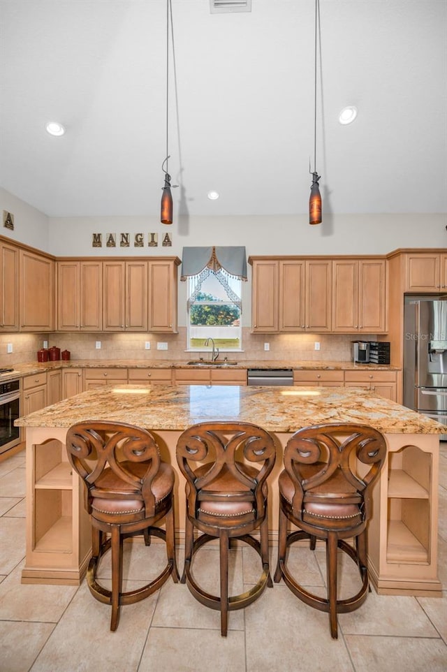 kitchen featuring tasteful backsplash, a center island, light stone countertops, stainless steel appliances, and open shelves