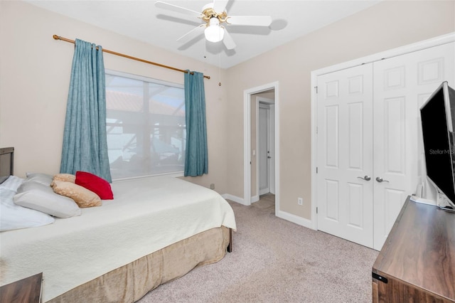 bedroom with carpet floors, a closet, a ceiling fan, and baseboards