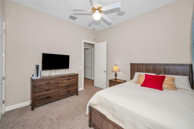 carpeted bedroom featuring visible vents, ceiling fan, and baseboards