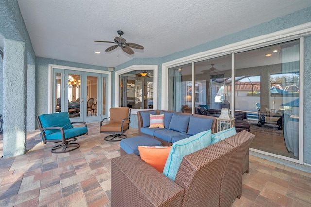 view of patio featuring ceiling fan, outdoor lounge area, and french doors