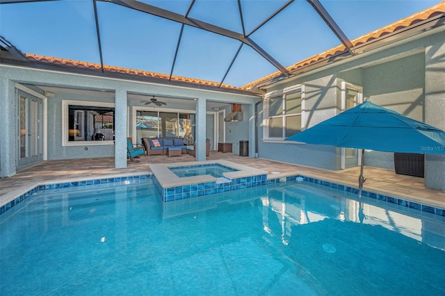 outdoor pool with a patio, ceiling fan, an outdoor hangout area, an in ground hot tub, and a lanai