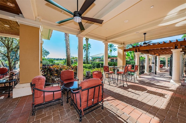 view of patio with ceiling fan and a pergola