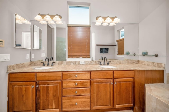 bathroom featuring a sink and double vanity