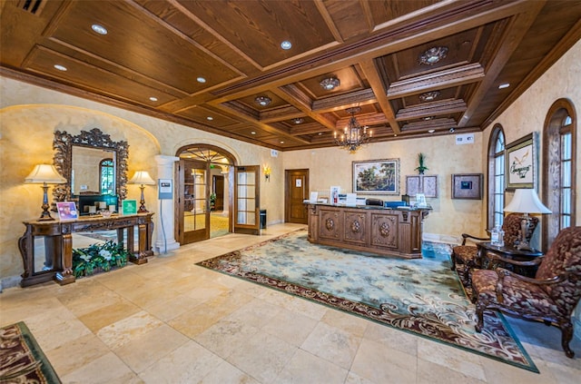 interior space with arched walkways, wooden ceiling, coffered ceiling, french doors, and crown molding