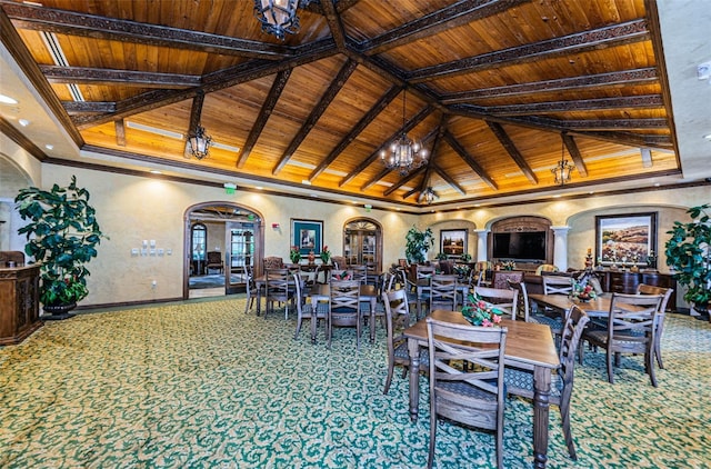 dining room featuring arched walkways, carpet, wood ceiling, and an inviting chandelier