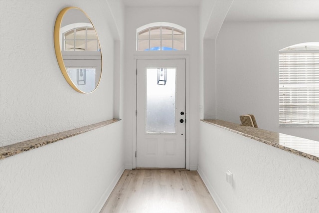 doorway to outside with light hardwood / wood-style flooring