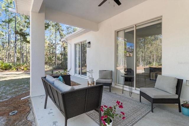 view of patio with outdoor lounge area and ceiling fan