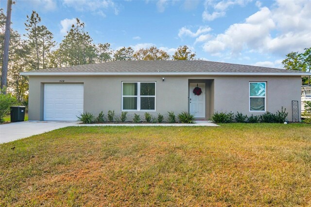 ranch-style home featuring a garage and a front yard