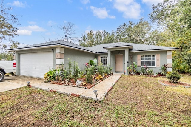 single story home featuring a front lawn and a garage