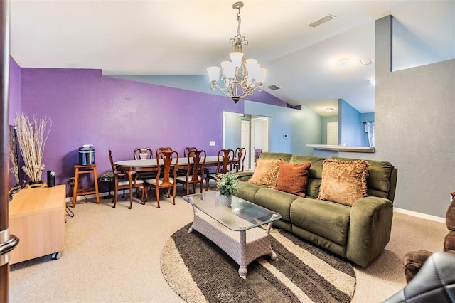 carpeted living room with a notable chandelier and vaulted ceiling