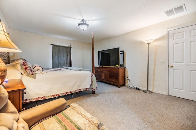 bedroom featuring light carpet