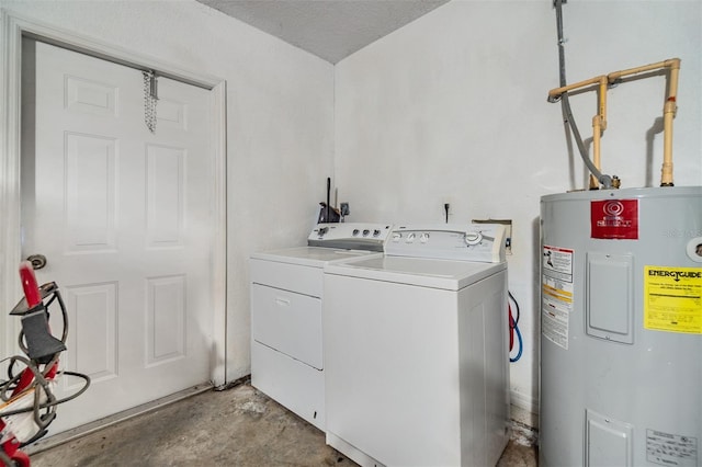 laundry area with electric water heater, a textured ceiling, and separate washer and dryer