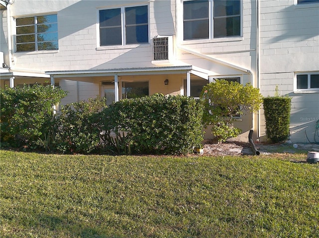 view of property exterior with a lawn