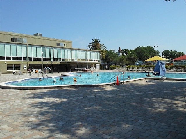 view of swimming pool featuring a patio area