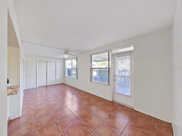 interior space featuring ceiling fan