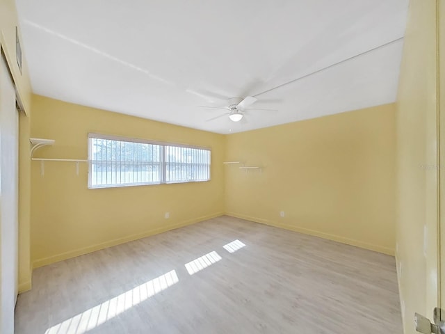 unfurnished room featuring ceiling fan and light hardwood / wood-style floors