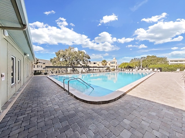 view of swimming pool featuring a patio area