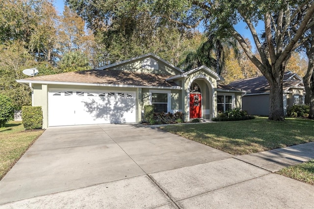 ranch-style house with a front yard and a garage