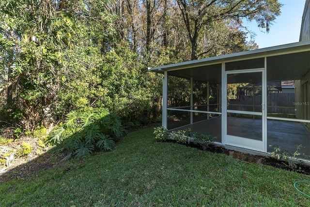 view of yard with a sunroom