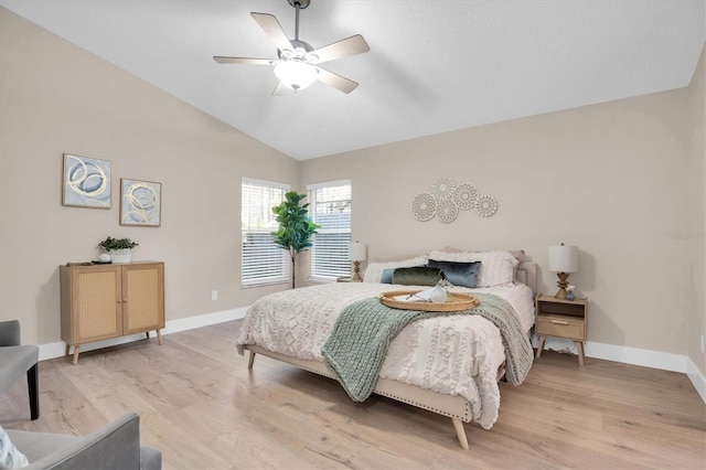 bedroom with light wood-type flooring, ceiling fan, and lofted ceiling