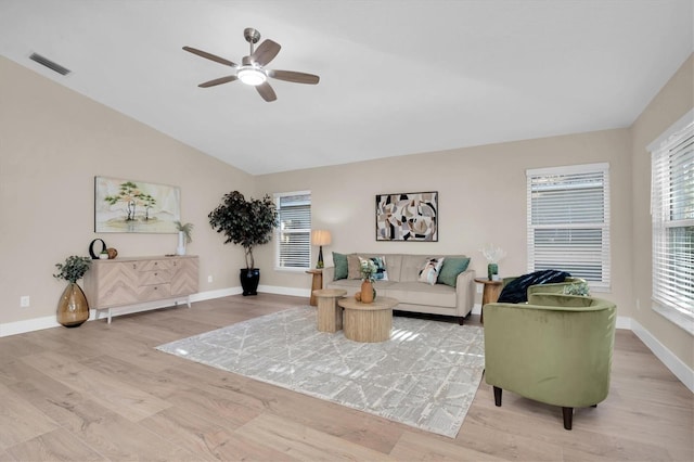 living room with ceiling fan, light hardwood / wood-style flooring, and lofted ceiling