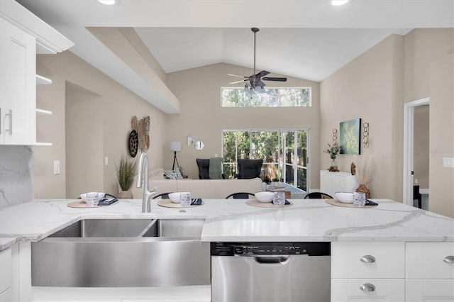 kitchen featuring stainless steel dishwasher, ceiling fan, light stone counters, and white cabinets