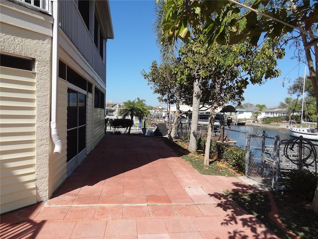 view of patio with a water view