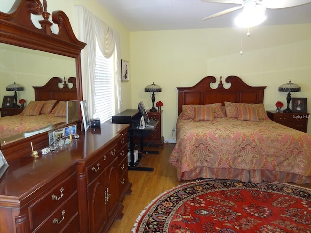 bedroom with light wood-type flooring and ceiling fan