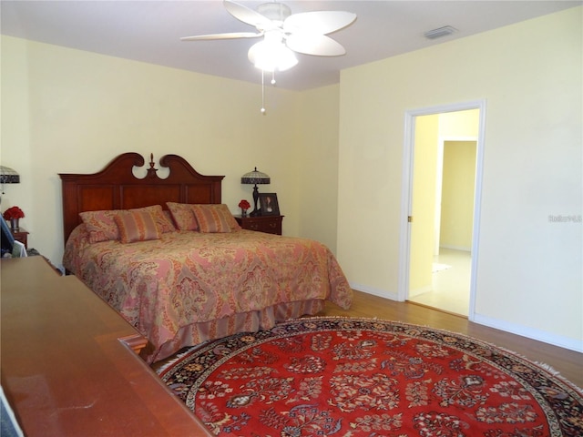 bedroom featuring hardwood / wood-style flooring and ceiling fan