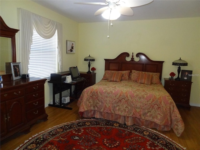 bedroom featuring wood-type flooring and ceiling fan