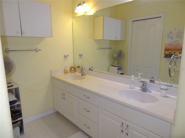 bathroom with tile patterned flooring and vanity