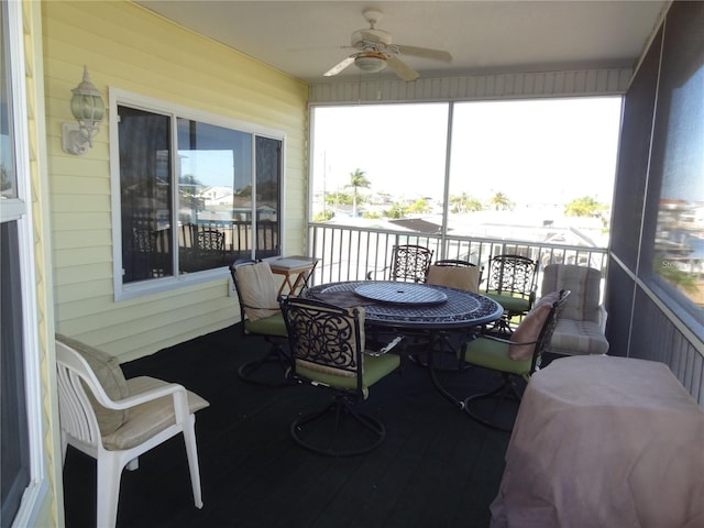 sunroom / solarium with ceiling fan