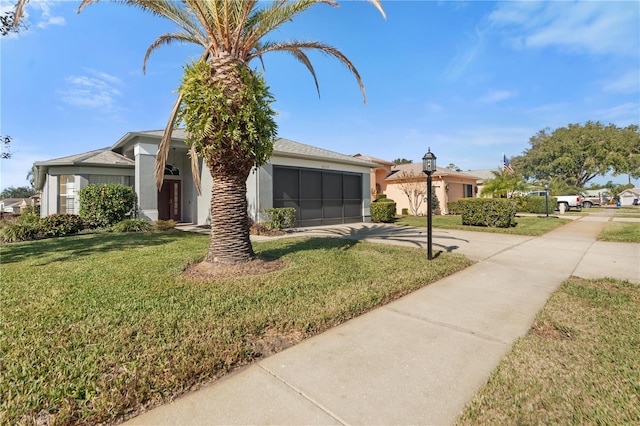 ranch-style home with a front lawn and a garage