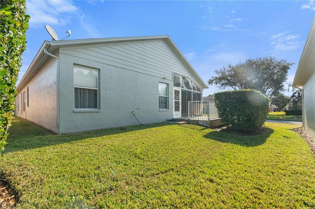 view of home's exterior featuring a yard