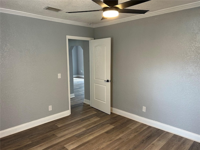 unfurnished room featuring crown molding, ceiling fan, and dark wood-type flooring