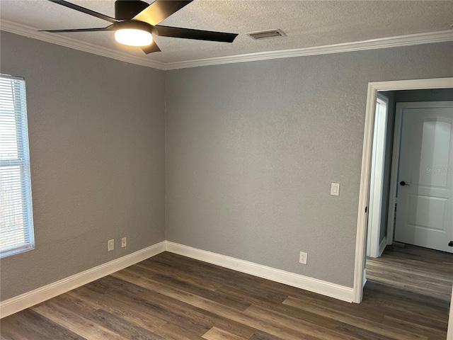 empty room featuring a textured ceiling, ceiling fan, crown molding, and dark hardwood / wood-style floors