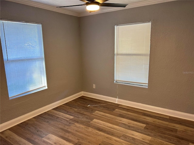 empty room featuring dark hardwood / wood-style floors, ceiling fan, and ornamental molding